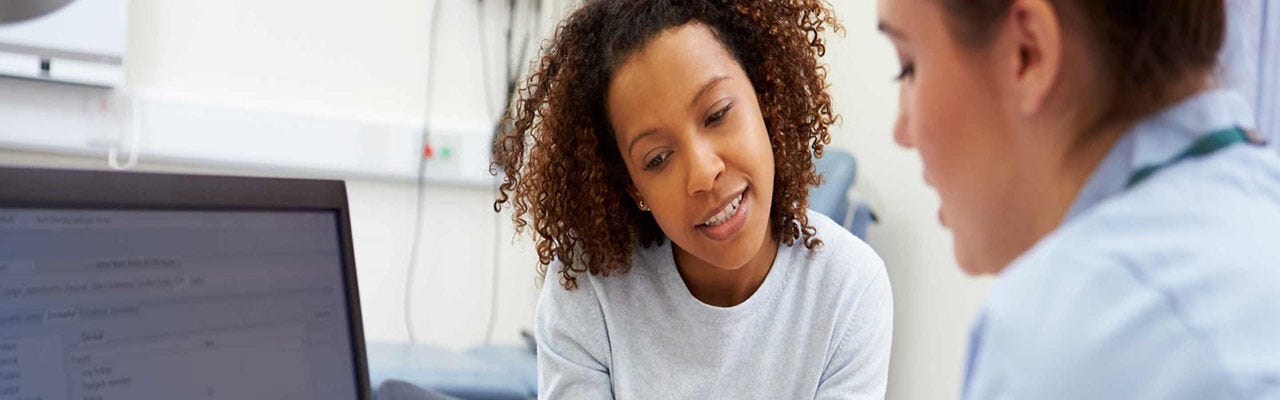 Healthcare professional explaining to patient