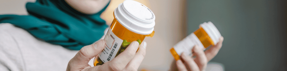 Man Reviewing Prescription Medications